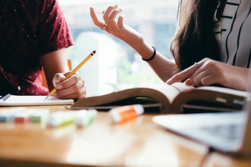 Young woman and man studying for a test or an exam.
