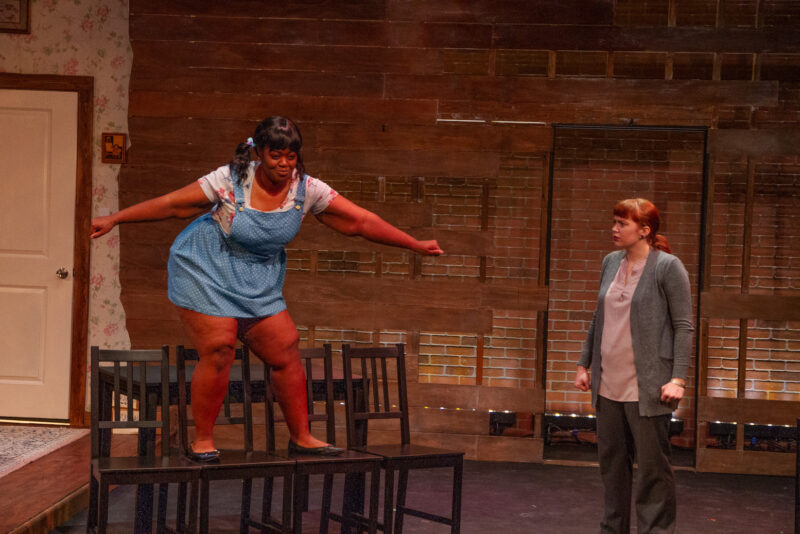 Drama students performing on stage