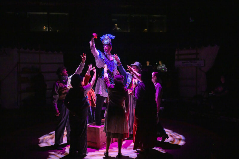 Students on stage in a dress rehersal