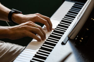 Hands on a piano