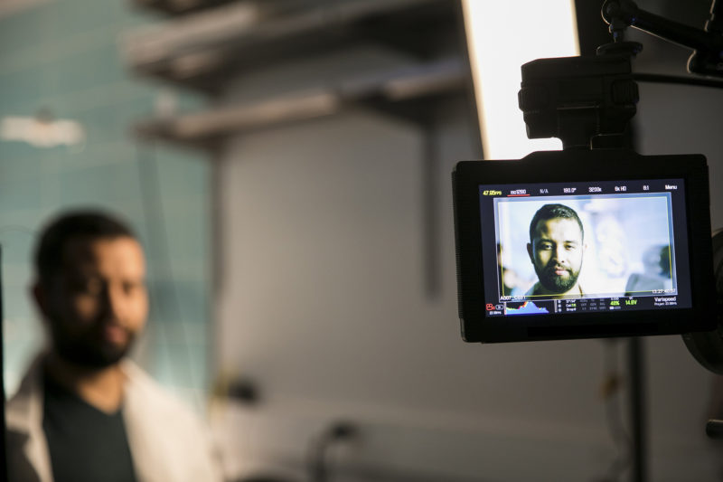 A man standing in front of cameras