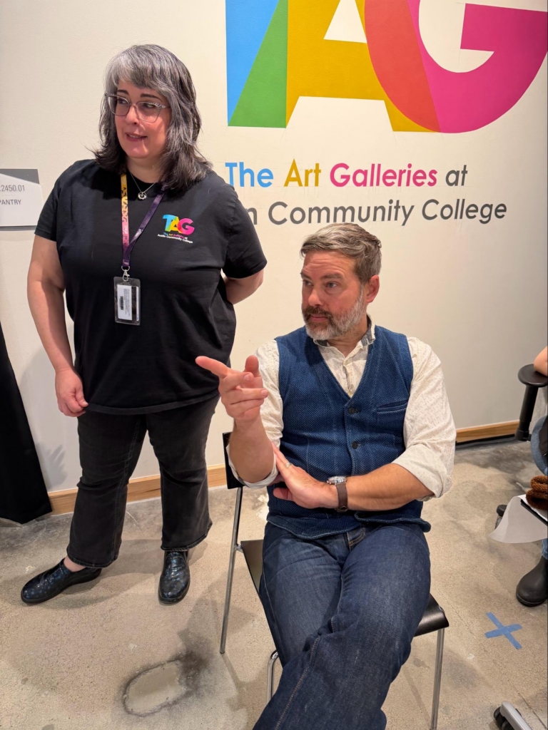 Gallery Tech Gina P. Woodruff and ACC Professor Thomas Holton observe the artmaking in process.