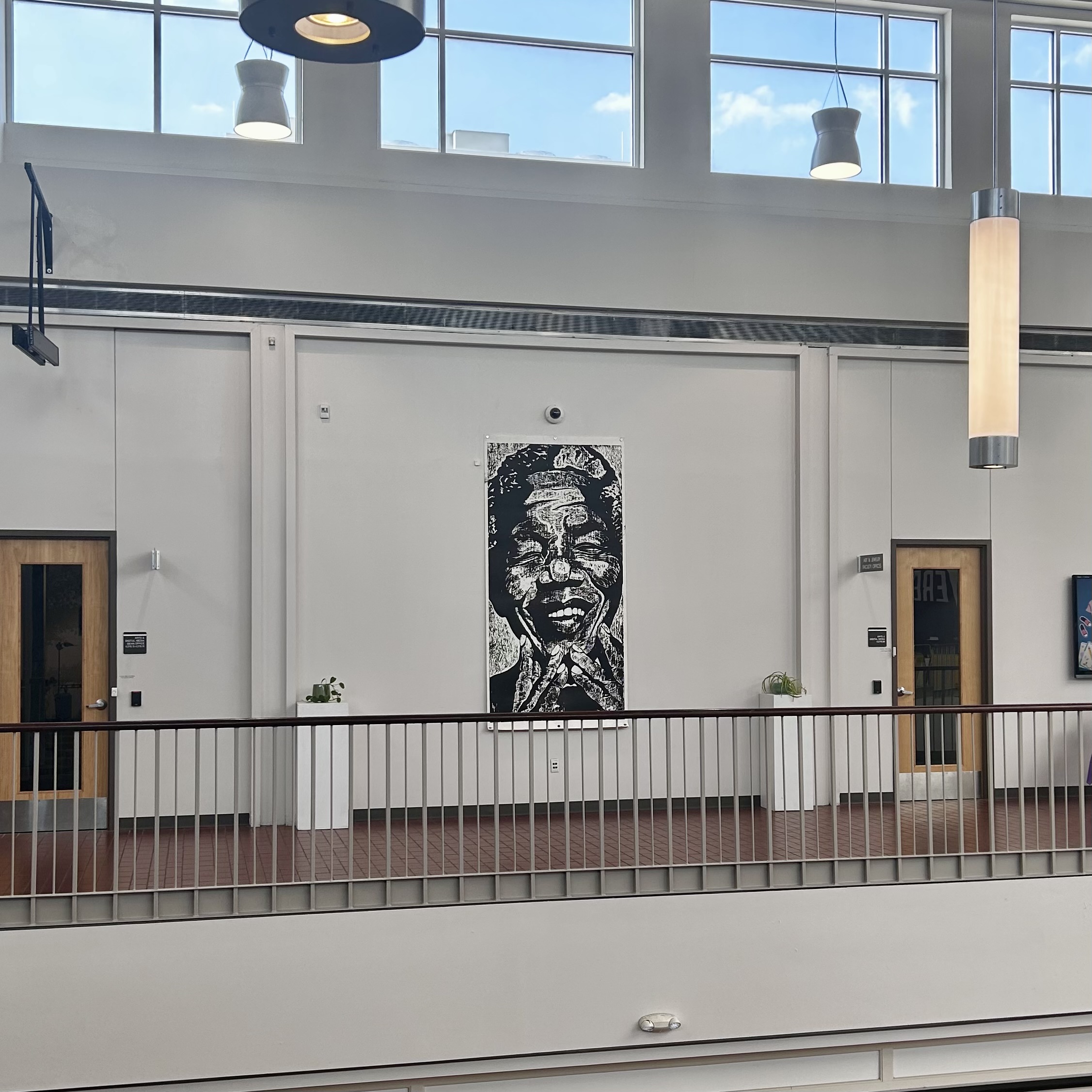 Image of artwork from the Permanent Collection located in the upstairs atrium of Building 4000 on Highland Campus.