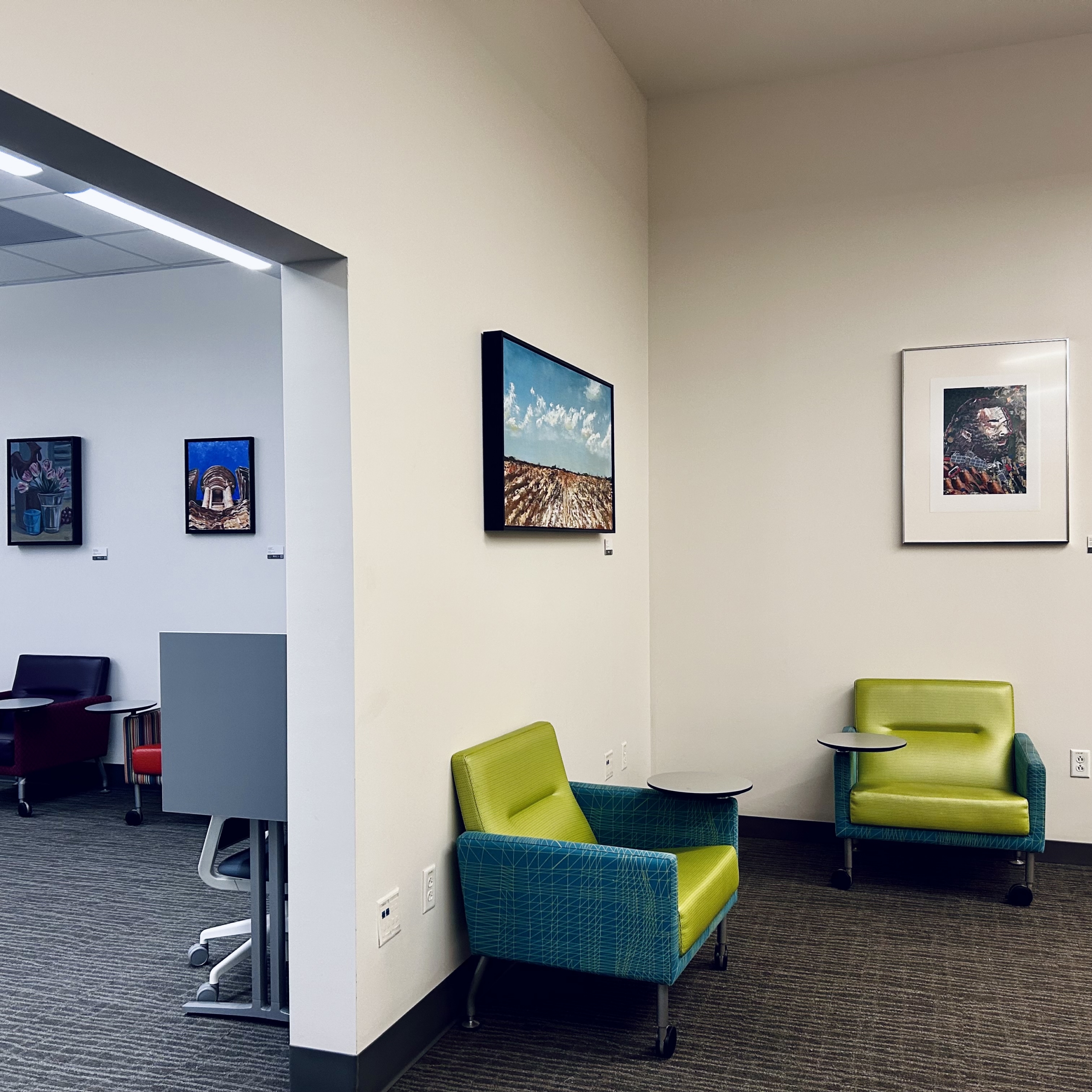 Image of artworks from the Permanent Collection on display in the ACC Highland campus library, downstairs in building1000.